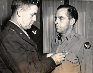 85th-FS-William-W.-Ogden-being-awarded-DFC-by-General-Charles-T.-Myers-via-his-family