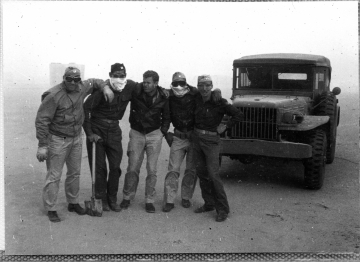 79th-FG-personnel-in-sandstorm-possibly-86th-FS-Tartleton-Watkins-in-middle.-Richards-Hoffman-collection-via-Hogue-and-Whittenberg