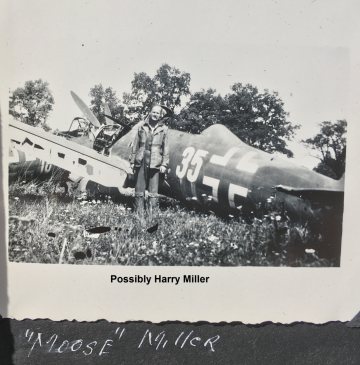 85th-FS-Harry-Moose-Miller-by-damaged-German-airplane-possibly-Switzerland-1945.-Stewart-Spencer-collection-via-Paul-Spencer