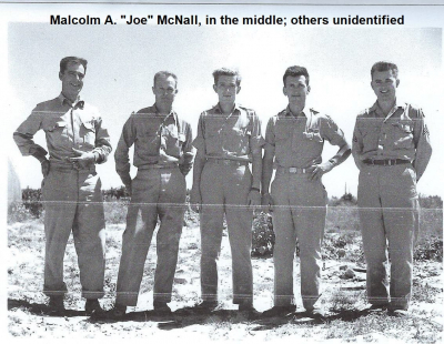 1_85th-FS-Malcolm-Joe-McNall-center-in-desert-with-other-personnel.-Malcolm-McNall-collection-via-Mike-McNall