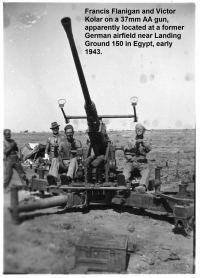 1_85th-FS-armorers-Francis-Flanigan-and-Victor-Kolar-on-37mm-anti-aircraft-gun.-James-Connors-collection-via-John-Connors