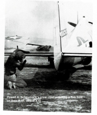 1_85th-FS-pilot-Powell-Scheumacks-P-47-X10-having-a-flak-hole-patched-by-his-crew-chief.-Photograph-via-Powell-Scheumack.