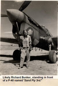 85th-FS-Richard-Bunker-likely-no-Lt.-Bauber-with-the-79th-FG-beside-a-P-40-named-Sand-Fly-3rd.-AFHRA-photograph-Copy