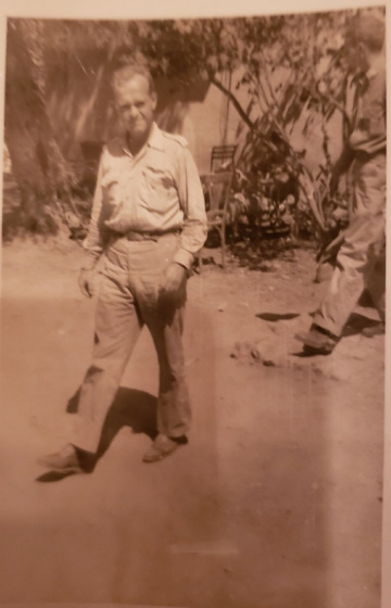 85th-FS-pilot-John-Hoagland-in-front-of-officers-club-at-Sicily-with-William-Abbott-close-behind.-Samuel-L.-Say-collection-via-family