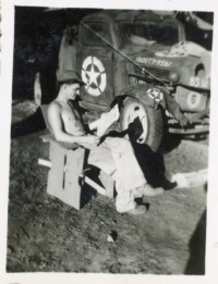 85th-FS-Elven-G.-Hubbard-possibly-reading-paper-by-truck.-Elven-G.-Hubbard-collection-via-his-family-1