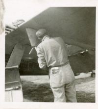 Unidentified-85th-FS-ground-crew-working-on-P-47-bomb-rack.-Elven-G.-Hubbard-collection-via-his-family