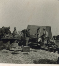 Unidentified-doing-work-outside-tent.-Elven-G.-Hubbard-collection-via-his-family-2