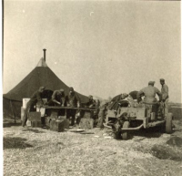 Unidentified-doing-work-outside-tent.-Elven-G.-Hubbard-collection-via-his-family