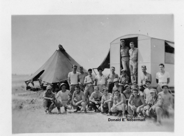 86th-FS-Donald-E.-Neberman-in-front-and-center-of-trailer-opening-hat-askew.-Others-unidentified.-Donald-E.-Neberman-collection-via-his-family.