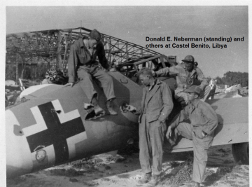 86th-FS-Donald-E.-Neberman-standing-beside-German-Bf-109-possibly-at-Castel-Benito.-Others-unidentified.-Donald-E.-Neberman-collection-via-his-family