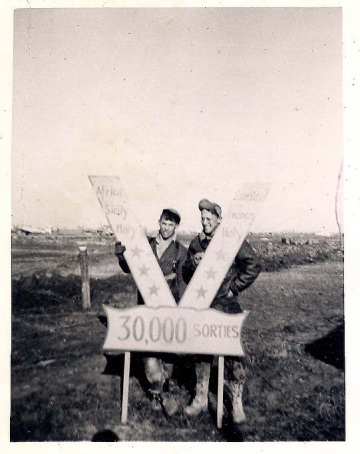 86th-FS-personnel-with-30000-Sorties-sign.-Lloyd-T.-Good-collection-via-Laurie-Olds