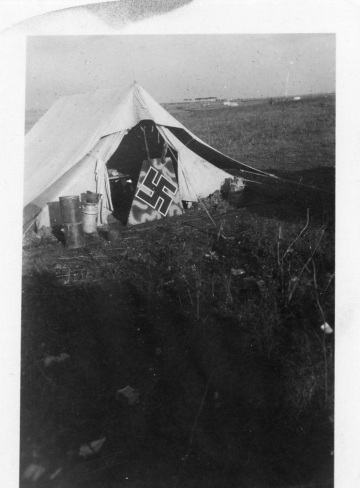 German-airplane-part-in-front-of-tent.-Donald-E.-Neberman-collection-via-his-family