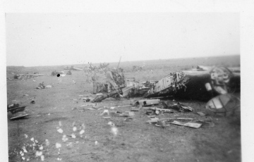 Unidentified-individuals-examining-wreckage.-Donald-E.-Neberman-collection-via-his-family