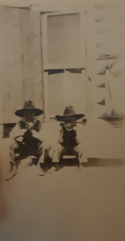 86th-FS-Romie-R.-Royse-with-brother-Robert-on-ranch-eating-watermelon-via-the-Royse-family