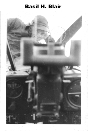 86th-FS-Basil-H.-Blair-looking-into-P-40-cockpit.-Basil-H.-Blair-collection-via-Alan-Blair