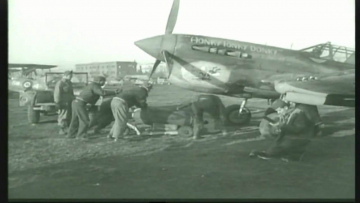 87th-FS-Albert-Lincicomes-P-40-X98-named-HONTY-TONKY-DONKY-at-Capodichino-Naples-Italy-January-1944.-Still-from-USAAF-film