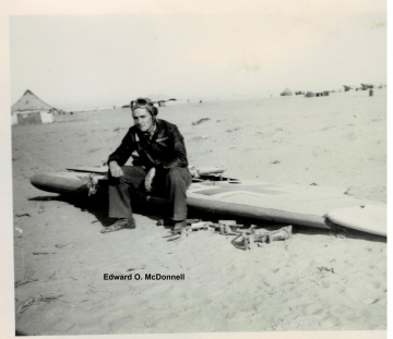 87th-FS-Edward-O.-McDonnell-sitting-on-German-airplane-wing.-Edward-O.-McDonnell-collection-via-the-McDonnell-Barry-family