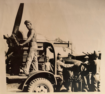 87th-FS-Engineering-Section-loading-bomb-on-P-47.-James-J.-Bell-collection-via-his-family