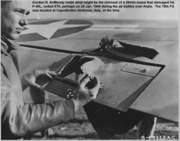87th-FS-Gordon-AcMoody-inspecting-P-40-damage1.-USAAF-photograph1