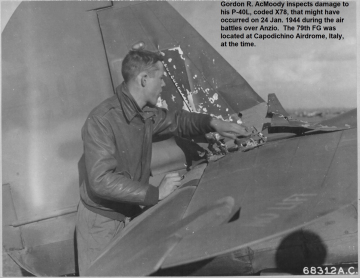 87th-FS-Gordon-AcMoody-inspecting-P-40-damage2.-USAAF-photograph1
