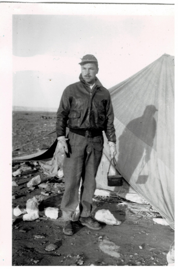 Unidentified-individual-by-tent.-Edward-O.-McDonnell-collection-via-the-McDonnell-Barry-family