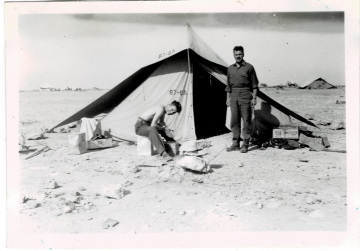Unidentified-individuals-in-front-of-87th-FS-tent.-Edward-O.-McDonnell-collection-via-the-McDonnell-Barry-family