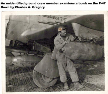 Unidentifed-examining-bomb-on-P-47.-Arden-Wollangk-collection-via-his-family