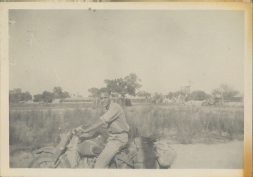 Unidentified-on-motorcycle-likely-87th-FS-on-Corsica-summer-1944.-Walter-B.-Snook-collection-via-his-family