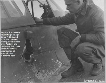 87th-FS-Gordon-AcMoody-inspecting-P-40-damage.-USAAF-photograph
