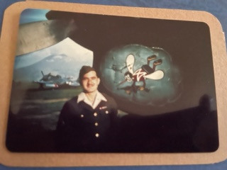 87th-FS-Sam-M.-Freedman-beside-Skeeter-insignia-on-a-P-40.-Sam-Freedman-collection-via-his-family